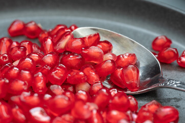 A silver spoon to eat pomegranate