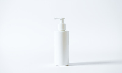 plain white mockup bottle for facial cleanser on white background, showcasing minimalist design. Ideal for product presentations and branding