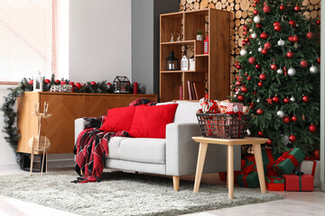 Interior of living room with sofa, Christmas tree and Advent calendar on table