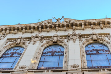 Elegant corner building with classical architecture against a clear blue sky in Belgrade, Serbia. Perfect for urban design, travel, and historical content. High quality photo