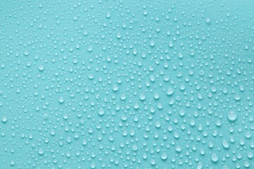 Water drops on turquoise background, above view