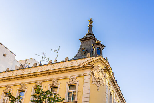 Elegant corner building with classical architecture against a clear blue sky in Belgrade, Serbia. Perfect for urban design, travel, and historical content. High quality photo