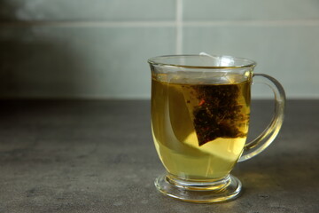 Aromatic and Invigorating Tea in a Clear Glass Mug with Infusion of Natural Leaves