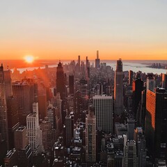 Fototapeta premium City Skyline Against a Vibrant Orange Sunset, Buildings Casting Long Shadows, Warm Light Illuminating City Details