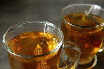 Enjoy a Refreshing Herbal Tea served in Transparent Glass Mugs for a delightful experience