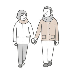 手を繋いで歩く冬服のシニアカップル