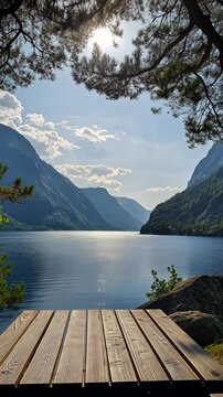 Scenic lake view from wooden deck, serene mountain landscape. Nature tranquility and relaxation concept