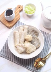 Pempek or empek-empek is a savoury Indonesian fishcake delicacy, made of fish and tapioca, from Palembang, South Sumatera, Indonesia. Pempek is served with rich sweet and sour sauce called cuko