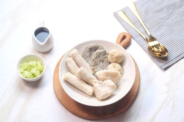 Pempek or empek-empek is a savoury Indonesian fishcake delicacy, made of fish and tapioca, from Palembang, South Sumatera, Indonesia. Pempek is served with rich sweet and sour sauce called cuko