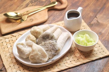 Pempek or empek-empek is a savoury Indonesian fishcake delicacy, made of fish and tapioca, from Palembang, South Sumatera, Indonesia. Pempek is served with rich sweet and sour sauce called cuko