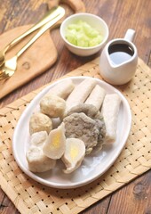 Pempek or empek-empek is a savoury Indonesian fishcake delicacy, made of fish and tapioca, from Palembang, South Sumatera, Indonesia. Pempek is served with rich sweet and sour sauce called cuko