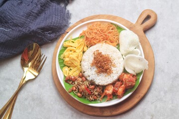 Nasi gurih is an Indonesian steamed rice cooked in coconut milk and spices dish originally from north Sumatera, Indonesia. So delicious