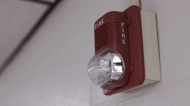 Fire alarm with emergency flashing light on the wall of office 4k
