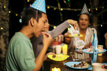 Friends Celebrating Birthday with Cake Outdoors