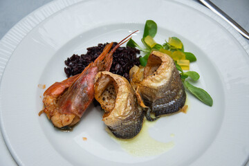 fried seafood platter. Shrimp, , fish and rice
 black, gelatin and vegetables