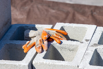 Gloves on cinderblock