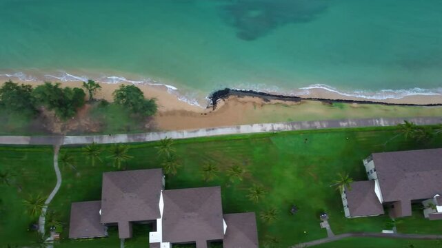 Aerial view of Kapaa Beach Park, Tropical Hawaiian beach with turquoise blue water in Kauai Hawaii. Waterfront beachfront resort in Hawaii