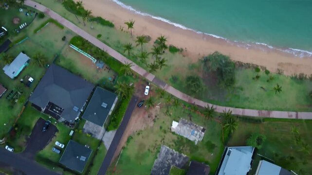 Kapaa Beach Park. Top down View of kappa beach in Kauai Hawaii. Cinematic Aerial Hawaiian beach with turquoise blue water
