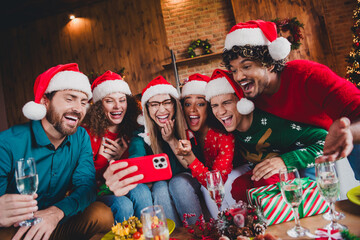 Photo of attractive young people have fun video call selfie photo new year decoration interior celebrate home party apartment