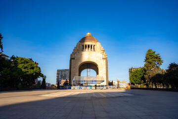 Morning view of the Monument to the Revolution in Mexico City, showcasing clear blue skies and...