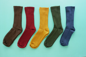 Explore our vibrant and colorful socks collection showcased beautifully on a mint background