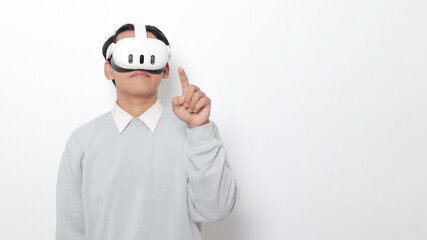 Portrait of Asian man using virtual reality VR device, experiencing immersive technology. Isolated image on white background