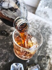 Cola drink with ice cubes