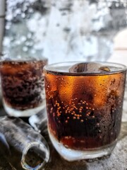 Cola drink with ice cubes