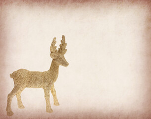 Christmas golden deer on old paper, holiday decorations in home interior