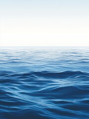 Fototapeta premium A serene view of calm ocean waves blending with a clear sky.