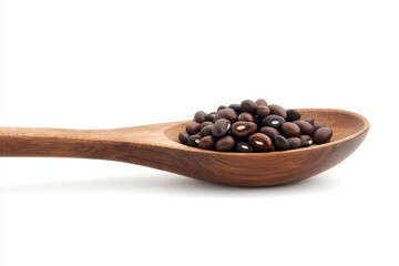 Fototapeta premium Black beans in wooden spoon on background