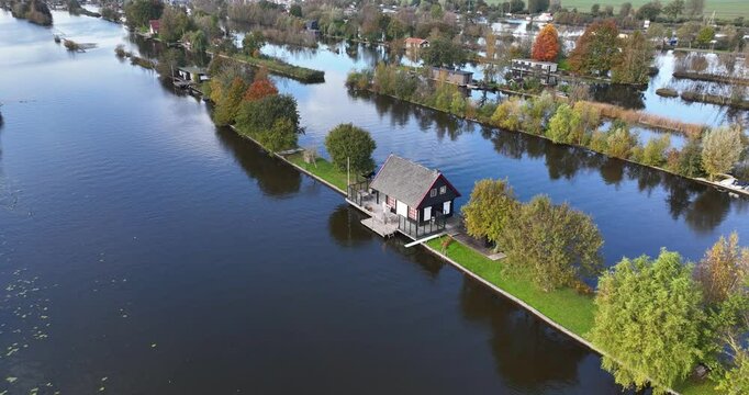 Small recreational houses at Scheendijk, water and recreational area, Loosdrechtse plassen. Aerial drone video