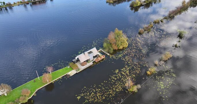 Small recreational houses at Scheendijk, water and recreational area, Loosdrechtse plassen. Aerial drone video