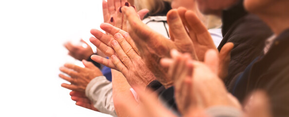 Clapping hands of a group of people in a row on white background. Grateful senior adults applauding with enthusiasm. Anonymous and in casual attire.