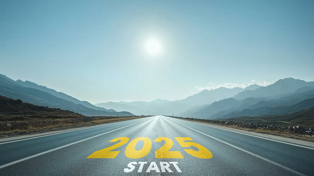 Open road with "2025 start" marking leading to mountains under clear sky
