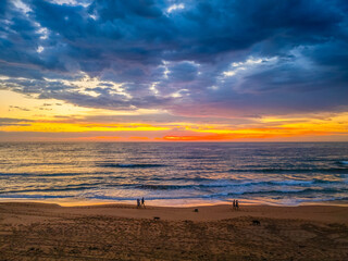 Pretty Sunrise at the seaside with rain clouds