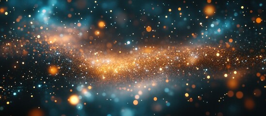 Naklejka premium Abstract background with sparkling dust and bokeh lights in blue and orange tones.