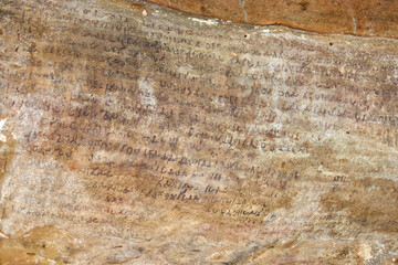 Early 2nd century BC Indian epigraphy or cave script by king kharavela at Udayagiri hills in Bhubaneswar, Odisha, India