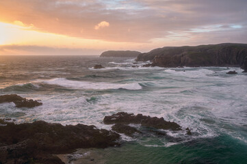 Stunning sunset over the sea at Mangersta beach on the Isle of Lewis in the Outer Hebrides of Scotland. High quality photo