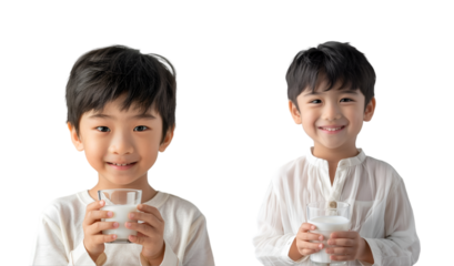 Child with glass of milk in hand on white background