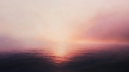 A soft, blurred sunset over a calm body of water. The sky is filled with a soft, pink and orange glow.