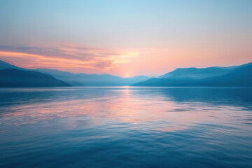 Obraz premium A serene sunset over a tranquil body of water, the last rays of light creating a beautiful reflection on the surface.