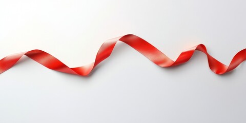 Red ribbon on a white background with subtle lighting ,space for text