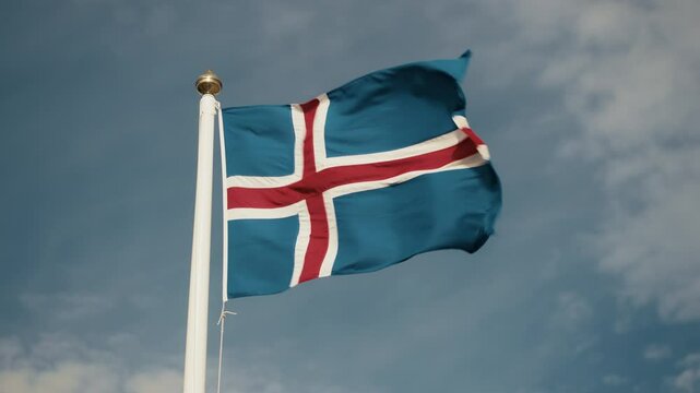 Icelandic flag waving in the wind in slow motion, patriotic and scenic
