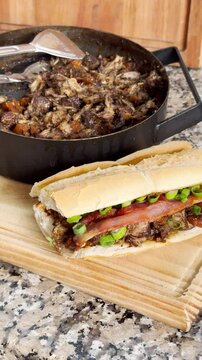 Vertical shot of shredded bondiola sandwich