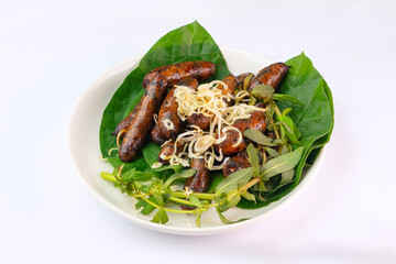 Tasty goat blood sausages. Grilled  goat blood sausages. Vietnam food. Doi de nuong. Ninh Binh food.