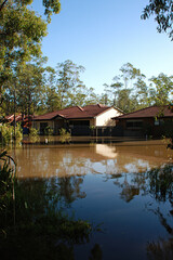 Obraz premium Suburban houses with water up to their windows after a flood