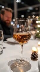 Obraz premium Elegant dining with a glass of german eiswein and candlelight ambiance