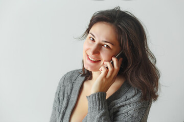 Attractive brunette woman using mobile phone