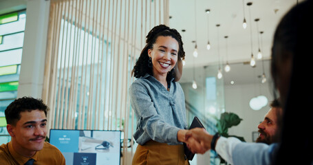 Women, shaking hands and happy meeting in office for welcome, smile and collaboration at media company. Business people, group and handshake with b2b agreement, deal and thanks at creative agency